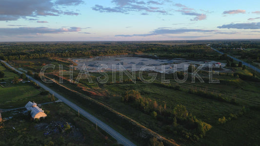Golden Hour Aerial Push Toward Sand and Stone Pit on Leachs Road