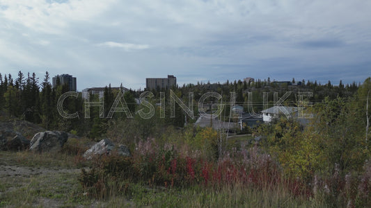 Fall Drone Ascent Over 48th Street Showing Downtown Yellowknife