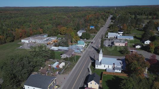 Reverse Drone Pullback on Hwy 62 with School and Library, Maynooth