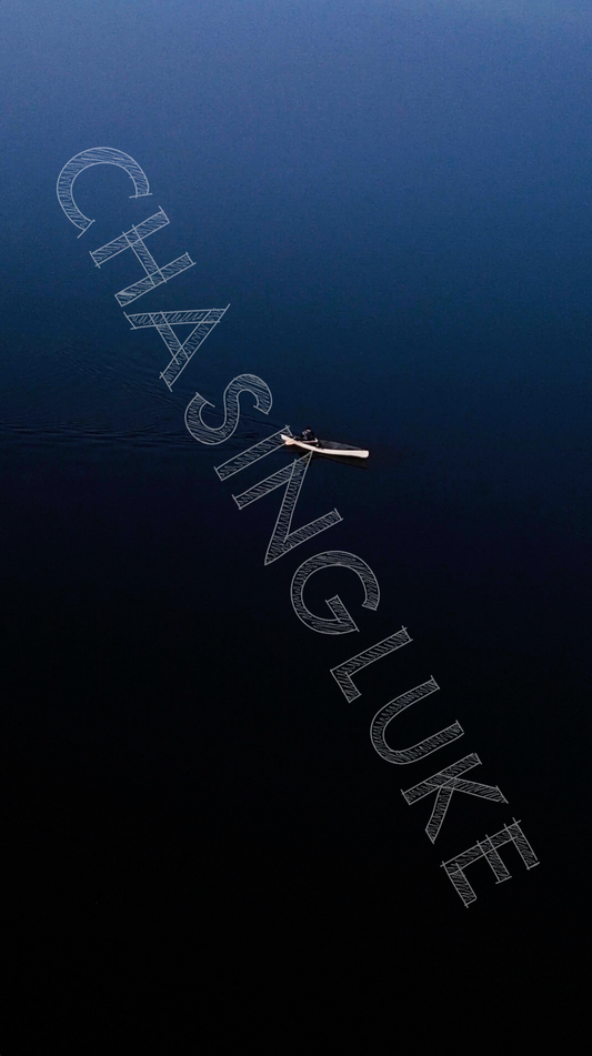 Minimalist Drone Shot of Solo Canoeist Crossing Vee Lake