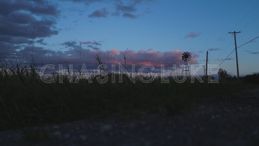 Ground-Level Drone Shot of Weather Vane Spinning at Blue Hour