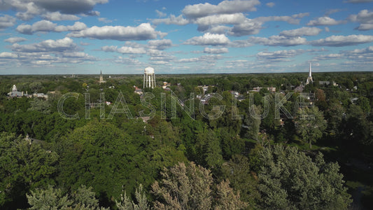 Tracking Aerial Over Perth Rooftops With Water Tower and Tay River