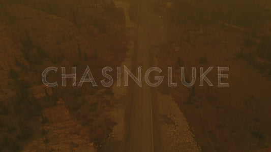 Tilt Down on Car Driving Under Ingraham Trail in Rust-Coloured Wildfire Smoke