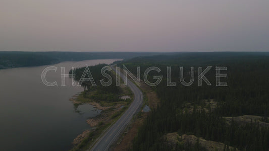 High Reverse Drone Flight Over Ingraham Trail Next To A Smoky Madeline Lake