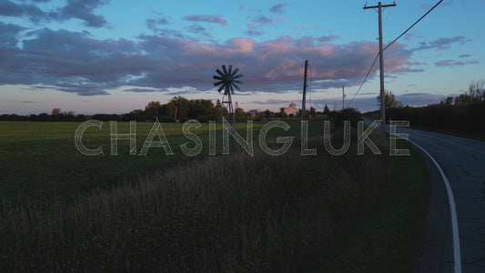 Drone Tracking Shot of Farm and Weather Vane at Sunset on Leachs Road