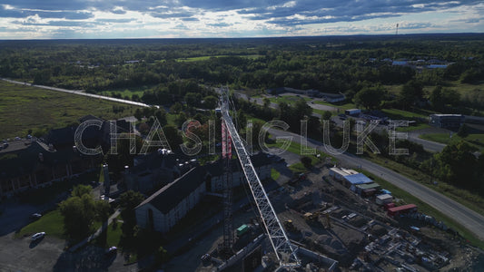 Angled Orbit Aerial Above Construction Crane Revealing Site in Perth